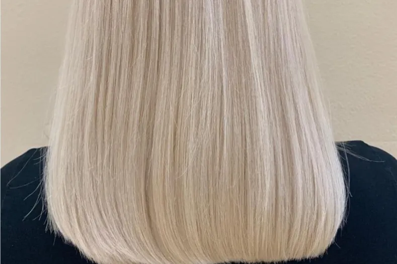Finished blonde double-process hair color on a straight cut